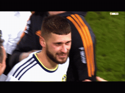 A Man With A Beard Wearing A White Shirt With The Word Adidas On The Sleeve GIF