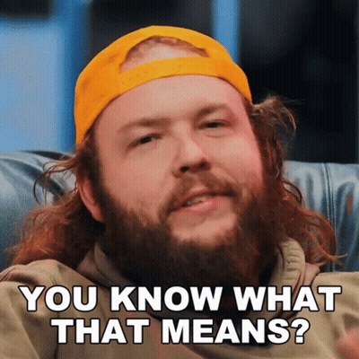 A Man With A Beard Wearing A Yellow Hat Is Asking You Know What That Means GIF