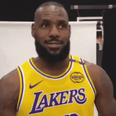A Man With A Beard Wearing A Yellow Lakers Jersey . GIF