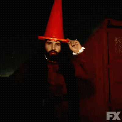 A Man With A Beard Wearing An Orange Cone And The Words We Drank The Blood Of Some People On The Bottom GIF