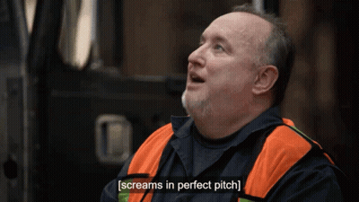 A Man With A Beard Wearing An Orange Vest Screams In Perfect Pitch GIF