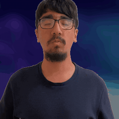 A Man With A Beard Wearing Glasses And A Black Shirt GIF