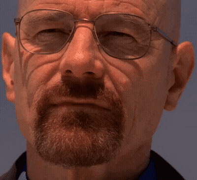 A Man With A Beard Wearing Glasses And A Blue Shirt GIF