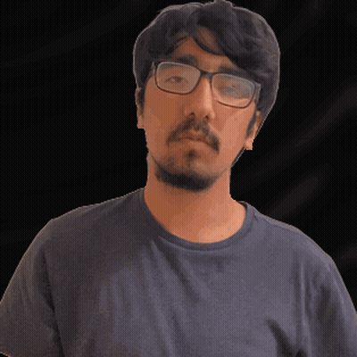 A Man With A Beard Wearing Glasses And A Blue Shirt GIF