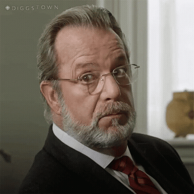 A Man With A Beard Wearing Glasses And A Tie GIF