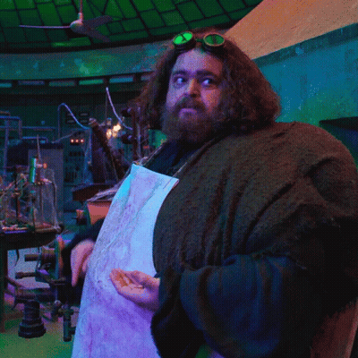A Man With A Beard Wearing Goggles And A White Apron GIF