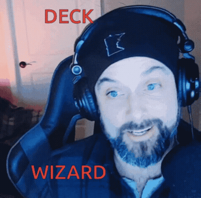 A Man With A Beard Wearing Headphones And A Beanie With The Word Deck Wizard On It GIF