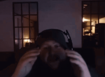 A Man With A Beard Wearing Headphones And A Hat GIF