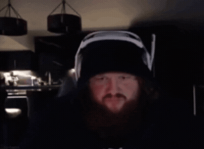 A Man With A Beard Wearing Headphones And A Hat Says Bro 'S The Sausage Sergeant GIF