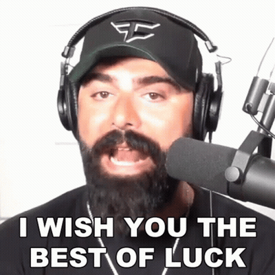 A Man With A Beard Wearing Headphones And A Hat Says I Wish You The Best Of Luck GIF