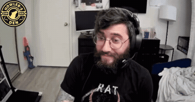 A Man With A Beard Wearing Headphones And A Rat Shirt GIF