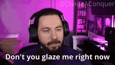 A Man With A Beard Wearing Headphones Is Sitting In Front Of A Microphone In A Purple Room . GIF