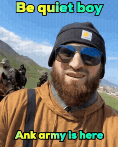 A Man With A Beard Wearing Sunglasses And A Beanie Says " Be Quiet Boy " GIF