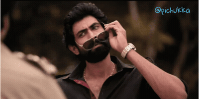 A Man With A Beard Wearing Sunglasses And A Watch With The Hashtag @Pichukka GIF