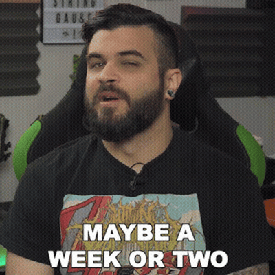 A Man With A Beard Wears A Black Shirt That Says Maybe A Week Or Two GIF