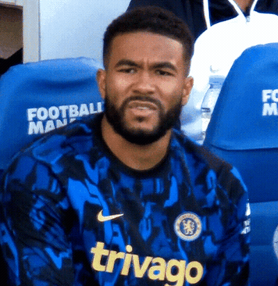 A Man With A Beard Wears A Blue Jersey That Says Trivago GIF