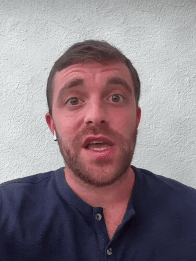 A Man With A Beard Wears A Blue Shirt GIF
