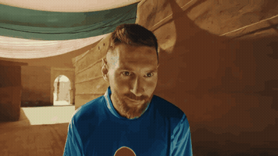 A Man With A Beard Wears A Blue Shirt With A Pepsi Logo On It GIF