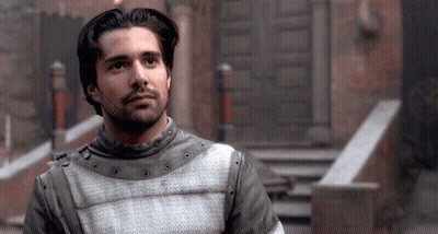 A Man With A Beard Wears A Gray And White Armor GIF