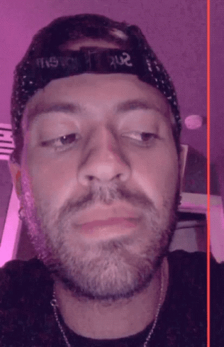 A Man With A Beard Wears A Hat That Says ' Ns ' On It GIF