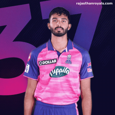 A Man With A Beard Wears A Pink And Blue Shirt That Says Dollar On It GIF