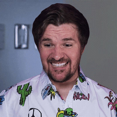 A Man With A Beard Wears A Shirt With A Cactus On It And The Word Warren On The Front GIF