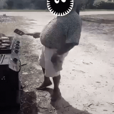 A Man With A Big Belly Is Standing In Front Of A Grill . GIF