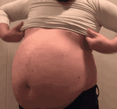 A Man With A Big Belly Is Wearing A White Shirt GIF