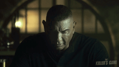 A Man With A Black Shirt That Says The Killer 'S Game On It GIF