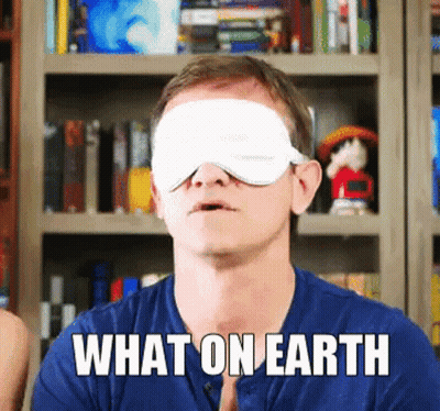 A Man With A Blindfold On His Eyes And The Words What On Earth Above Him GIF