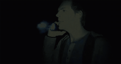 A Man With A Blue Light Coming Out Of His Face GIF