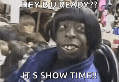 A Man With A Bob Hairstyle Is Sitting In A Chair And Making A Funny Face With A Caption . GIF