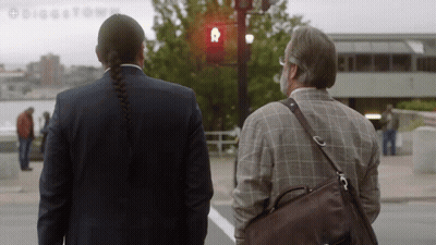 A Man With A Braided Hair Stands Next To A Man With A Beard GIF