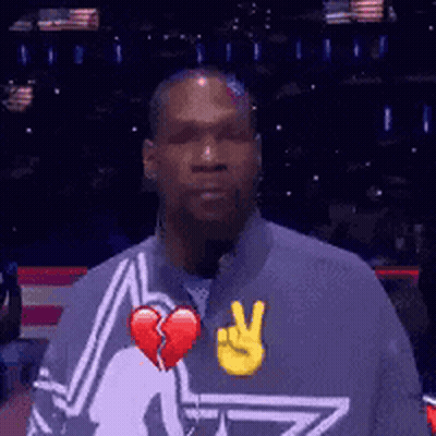 a man with a broken heart and a peace sign on his jacket
