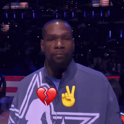 A Man With A Broken Heart And A Peace Sign On His Shirt GIF
