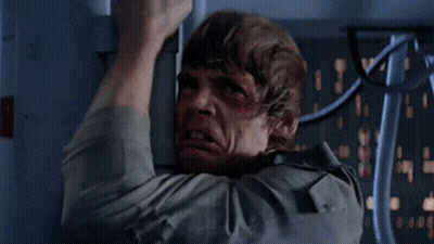 A Man With A Bruise On His Forehead Is Hanging From A Pole GIF