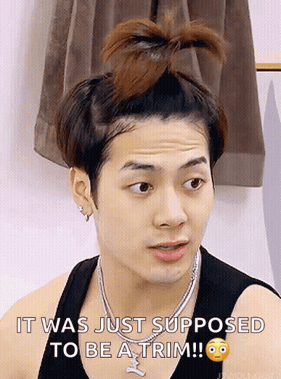 A Man With A Bun On His Head And A Necklace Says It Was Just Supposed To Be A Trim . GIF