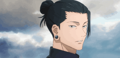 A Man With A Bun On His Head And Earrings GIF