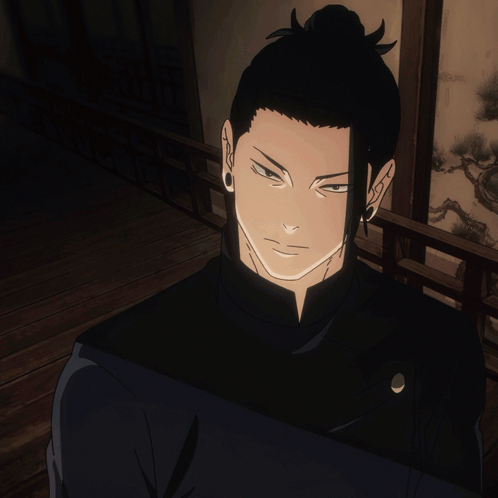 A Man With A Bun On His Head Is Giving The Thumbs Up GIF