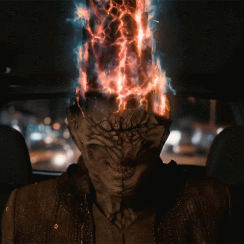 A Man With A Burning Head Is Sitting In A Car GIF