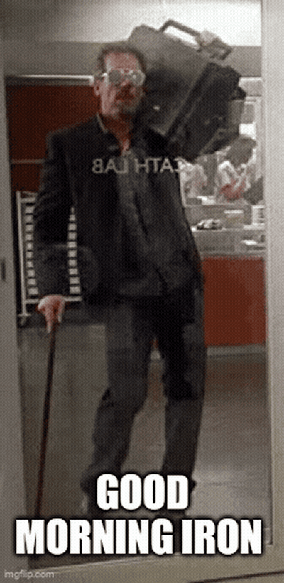 A Man With A Cane Is Carrying A Briefcase On His Shoulder And Says Good Morning Iron . GIF
