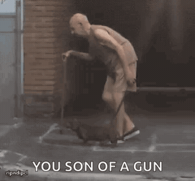 A Man With A Cane Is Standing Next To A Dog And Says You Son Of A Gun GIF