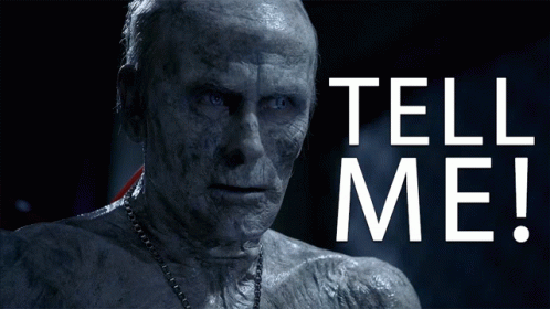 A Man With A Chain Around His Neck And The Words Tell Me On The Bottom GIF