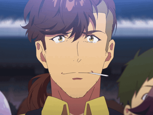 A Man With A Cigarette In His Mouth Looks Angry GIF