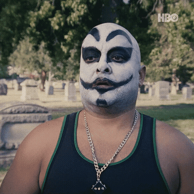 A Man With A Clown Face Painted On His Face Is Wearing A Black Tank Top GIF