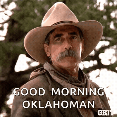 A Man With A Cowboy Hat And Mustache Is Saying Good Morning Oklahoma GIF