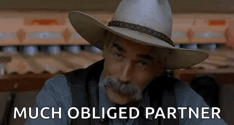A Man With A Cowboy Hat And Mustache Is Sitting In Front Of A Bowling Alley And Says `` Much Obliged Partner '' GIF