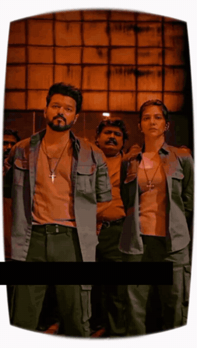 A Man With A Cross Necklace Stands Next To A Woman With A Cross Necklace GIF