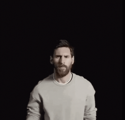 A Man With A Crown On His Head Points His Finger Up GIF