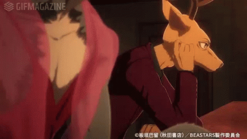 A Man With A Deer Head Is Sitting Next To A Woman In A Red Dress . GIF